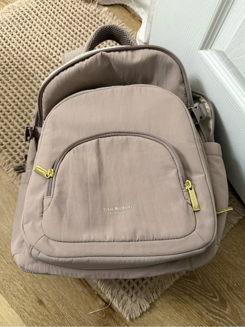 Isaac Mizrahi taupe colored backpack